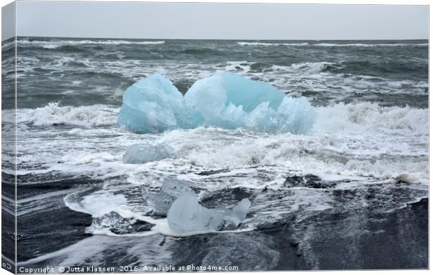 Blue ice floe on volcanic beach Canvas Print by Jutta Klassen