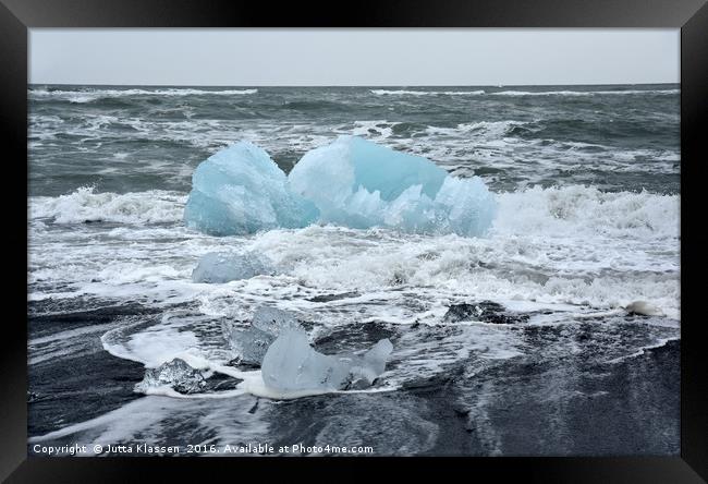 Blue ice floe on volcanic beach Framed Print by Jutta Klassen