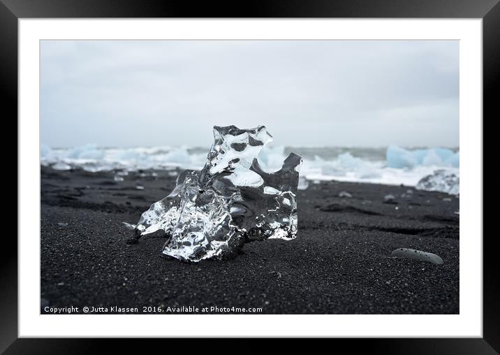 Crystal ice on black sand Framed Mounted Print by Jutta Klassen