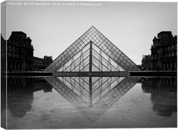 Louvre in the rain. Canvas Print by Nick Wardekker
