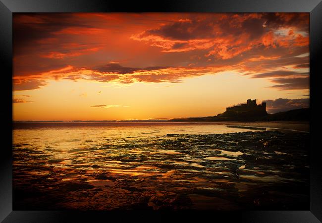 Bamburgh Castle Sunset Framed Print by J Biggadike