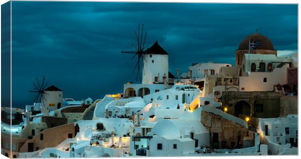 Oia Windmills Canvas Print by Paul Andrews