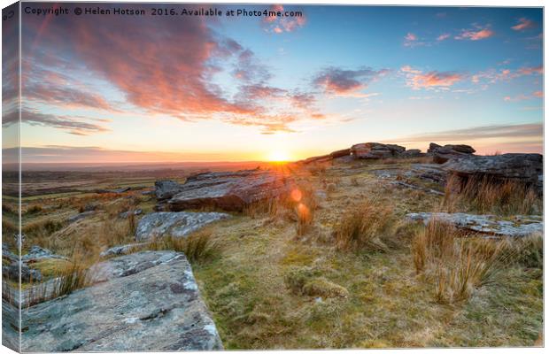 Stunning sunset over slabs of granite rocks at the Canvas Print by Helen Hotson