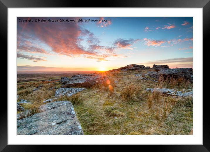 Stunning sunset over slabs of granite rocks at the Framed Mounted Print by Helen Hotson