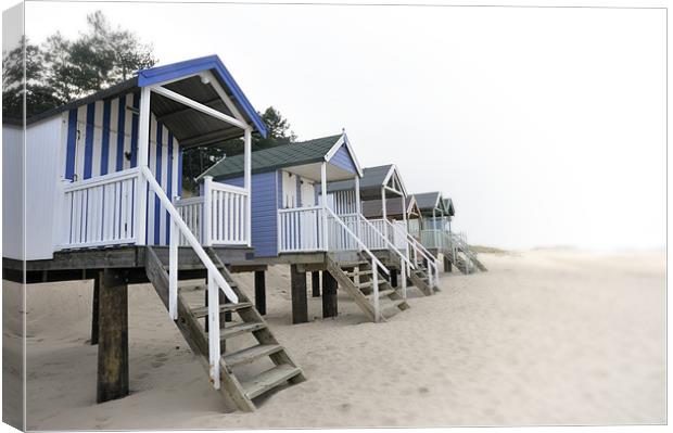 Faded beach huts at Wells Canvas Print by Stephen Mole