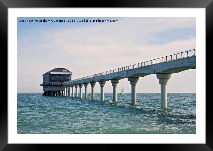 A yacht sails past Bembridge lifeboat station on t Framed Mounted Print by Graham Custance