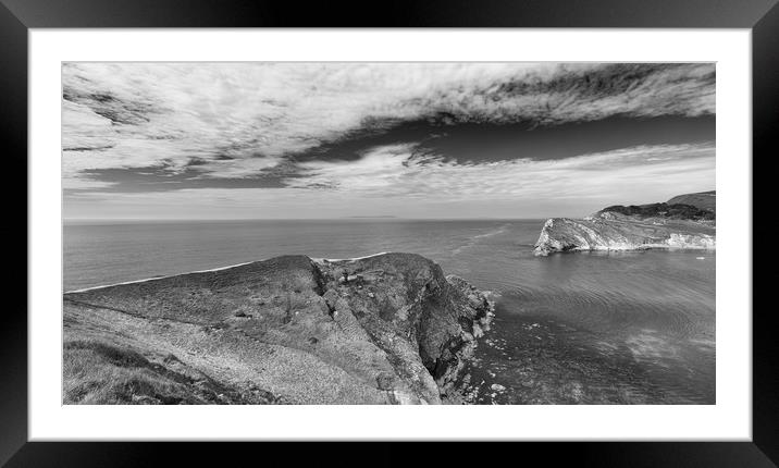 The entrance to Lulworth Cove in Monochrome.  Framed Mounted Print by Mark Godden