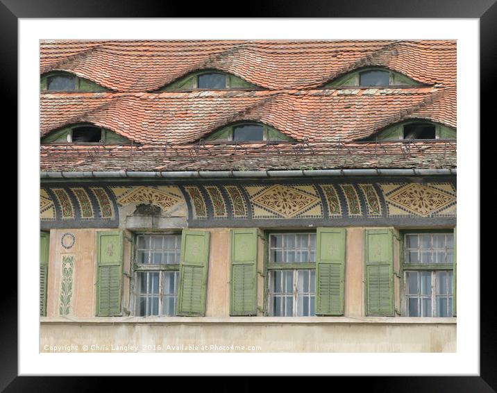 Roof Eyes in Sighisoara, Romania Framed Mounted Print by Chris Langley