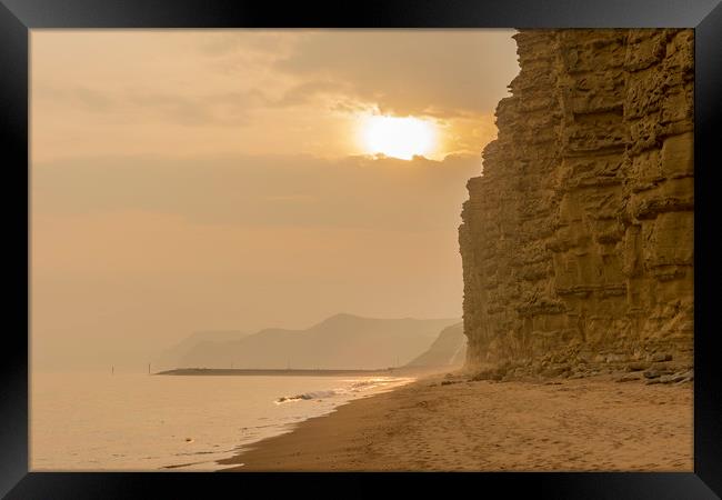 Jurassic Sunset at sultry West Bay Framed Print by Malcolm McHugh