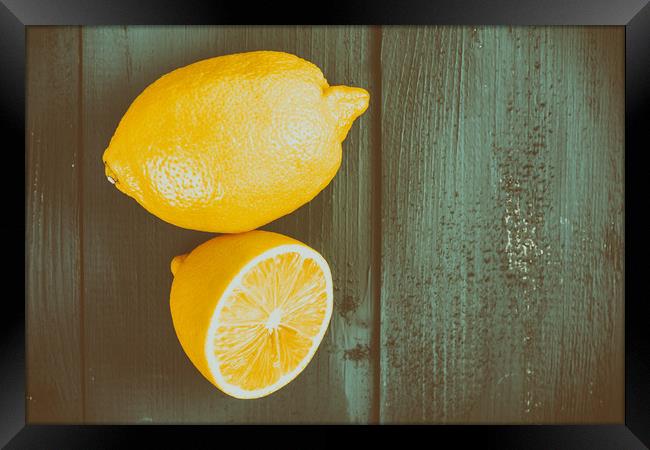 Fresh Yellow Lemons On Wooden Table Framed Print by Radu Bercan