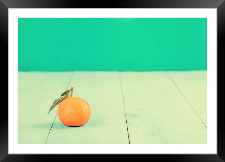 Fresh Tangerine On Blue Table Framed Mounted Print by Radu Bercan