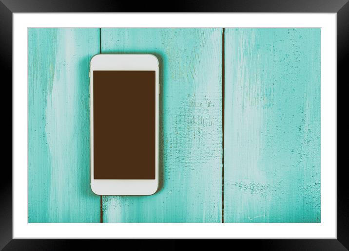 White Mobile Phone With Blank Screen On Wood Table Framed Mounted Print by Radu Bercan
