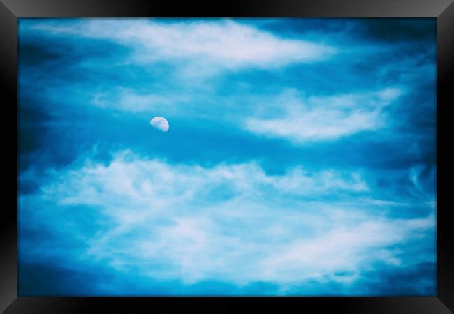 Moon Visible In Blue Sky With White Soft Clouds Framed Print by Radu Bercan