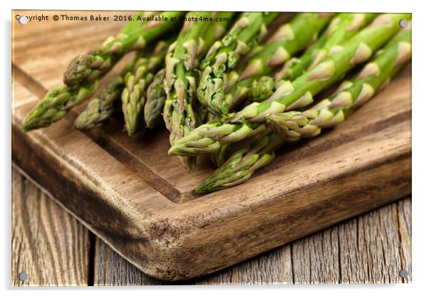 Fresh Asparagus on rustic wooden server board Acrylic by Thomas Baker