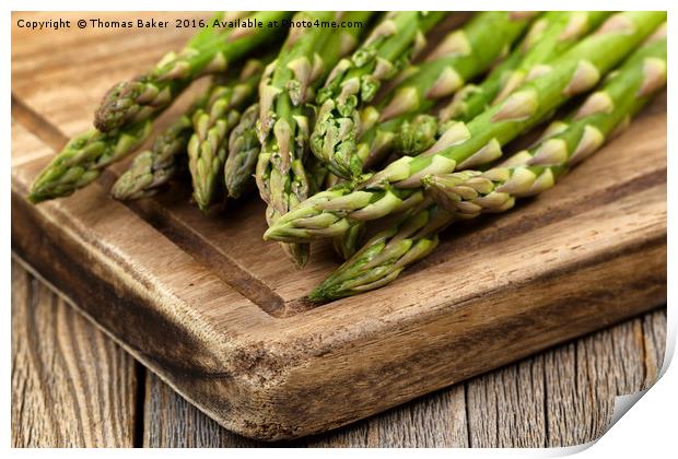 Fresh Asparagus on rustic wooden server board Print by Thomas Baker