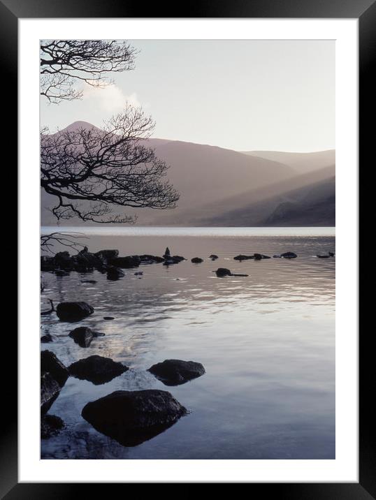 Shafts of sunlight at sunset of Crummock Water. Cu Framed Mounted Print by Liam Grant