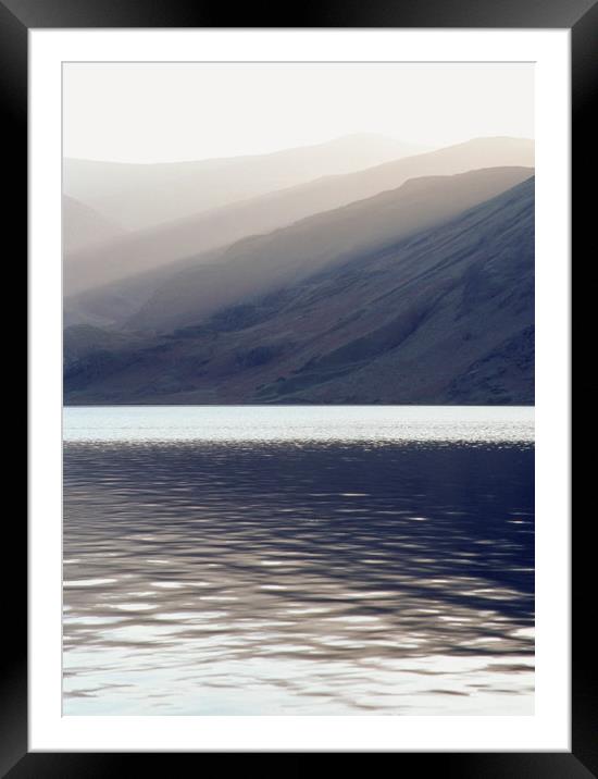 Shafts of sunlight at sunset of Crummock Water. Cu Framed Mounted Print by Liam Grant