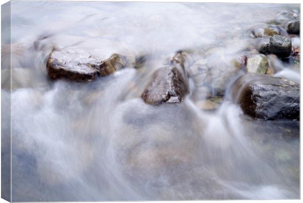 River water flowing between rocks. Cumbria, UK. Canvas Print by Liam Grant