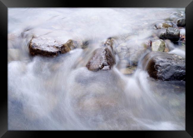 River water flowing between rocks. Cumbria, UK. Framed Print by Liam Grant