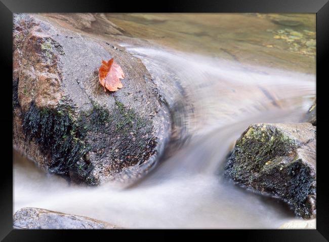 River water flowing between rocks. Cumbria, UK. Framed Print by Liam Grant