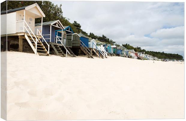 Beach Huts Canvas Print by Simon Wrigglesworth