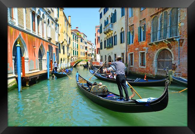 Gondolas on the canal                         Framed Print by Michael Oakes