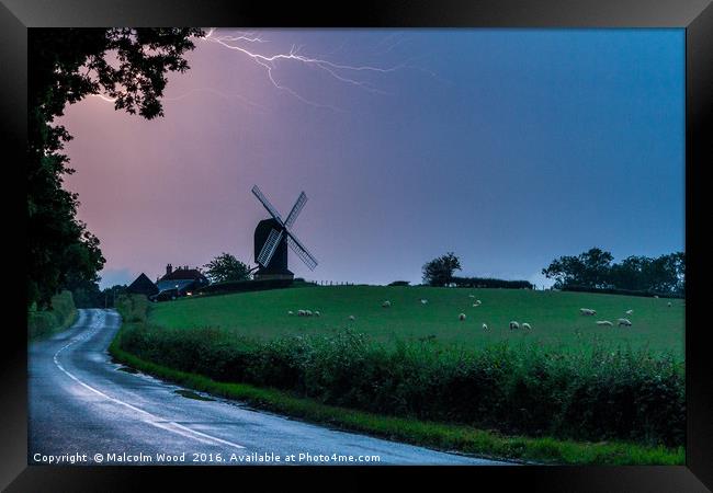 Lightning Over Windmill Framed Print by Malcolm Wood