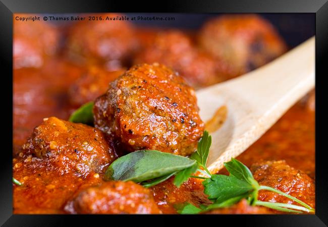 Freshly cooked meatballs in red sauce  Framed Print by Thomas Baker