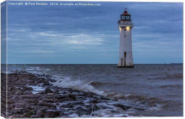 Lighthouse on the rocks Canvas Print by Paul Madden