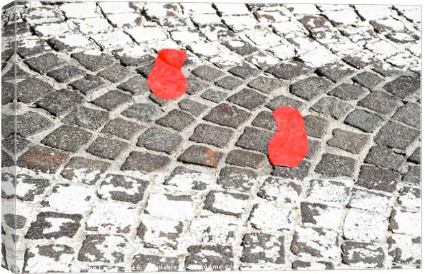 Red footsteps in town Canvas Print by Massimo Lama