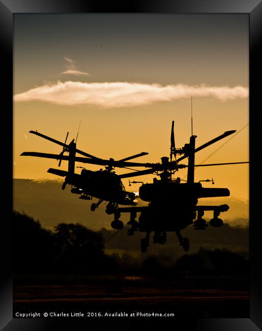 Apache Gunships at Sunset Framed Print by Charles Little