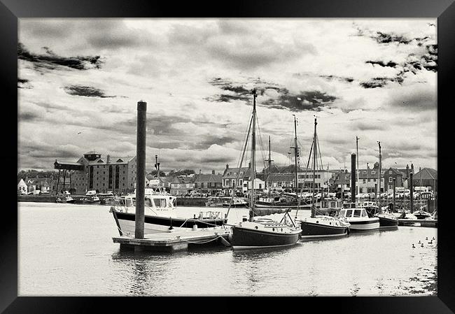 Boats moored in Wells Harbour Framed Print by Stephen Mole