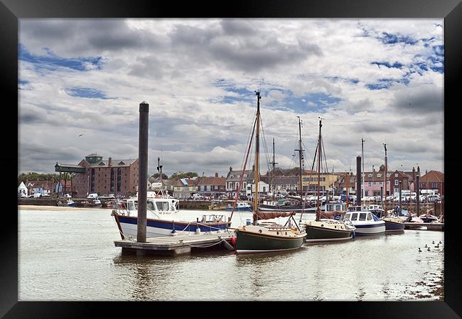 Boats moored in Wells Harbour Framed Print by Stephen Mole