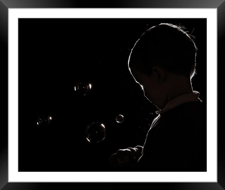 Boy Blowing Bubbles Framed Mounted Print by Jeni Harney