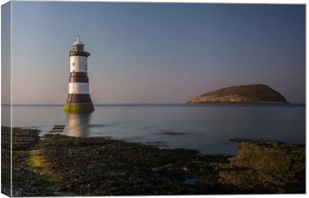 Penmon Lighthouse on Anglesey Canvas Print by Eric Pearce AWPF