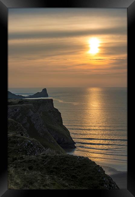 Sunset over the Worm's Head on the Gower Peninsula Framed Print by Nick Jenkins