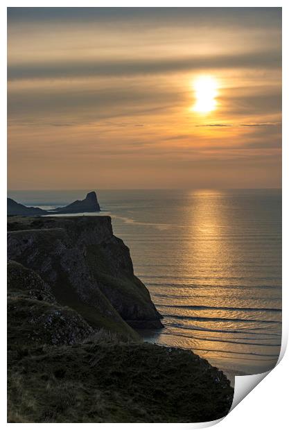 Sunset over the Worm's Head on the Gower Peninsula Print by Nick Jenkins