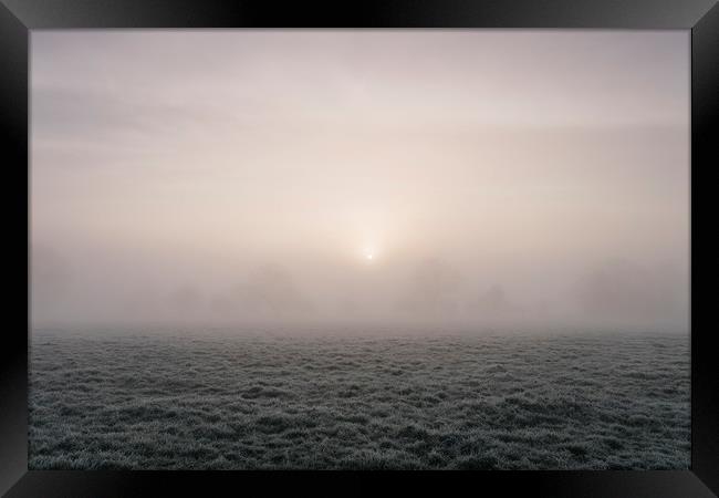 Sunrise through fog on a frosty morning. Norfolk,  Framed Print by Liam Grant