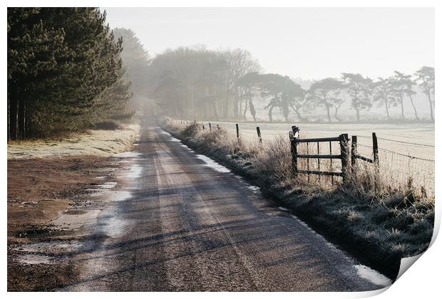 Remote frozen country road at sunrise. Norfolk, UK Print by Liam Grant