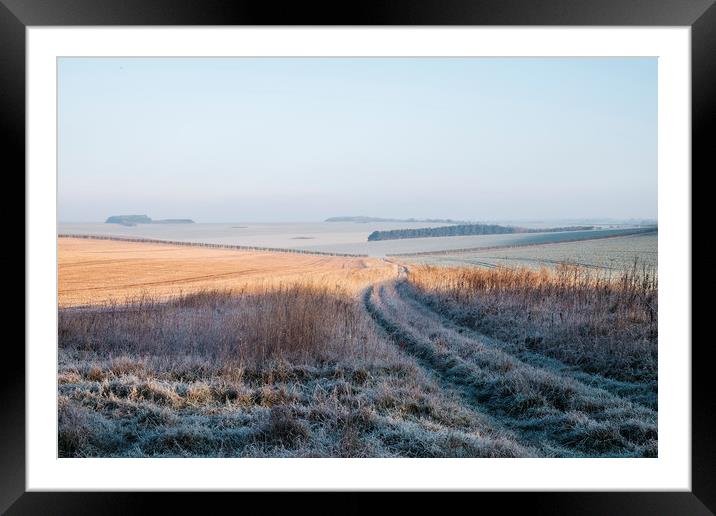 Frost covered track through fields at sunrise. Nor Framed Mounted Print by Liam Grant
