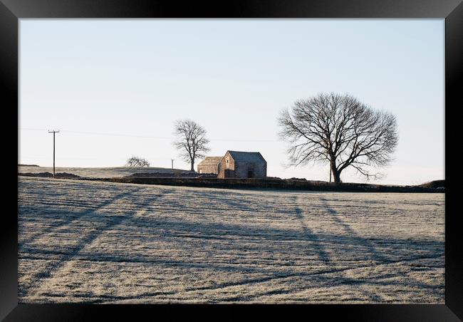 Stone barn in a field on a frosty morning. Derbysh Framed Print by Liam Grant