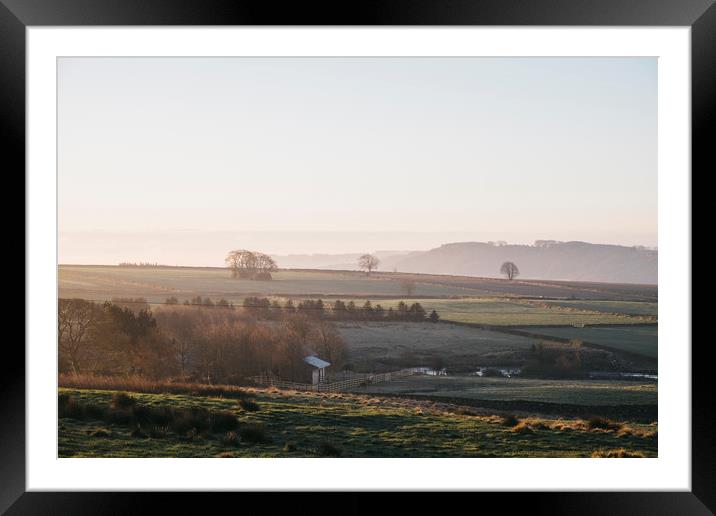 Early morning light at sunrise over a farm in Derb Framed Mounted Print by Liam Grant