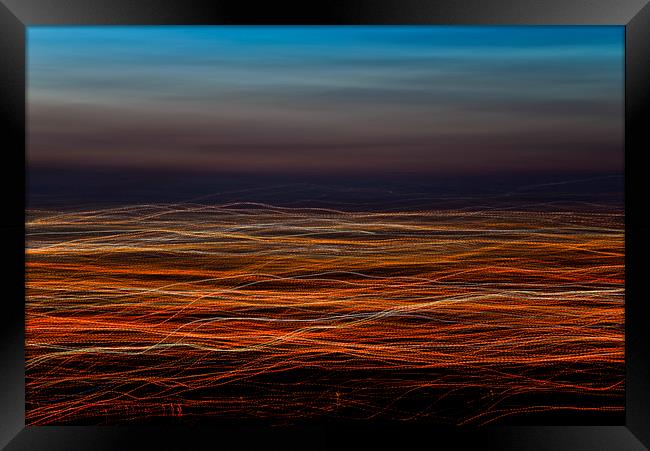 Trails of light at dusk Framed Print by Andrew Kearton