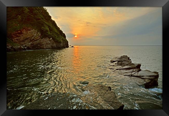 Sunset at Lee Abbey Bay Framed Print by graham young
