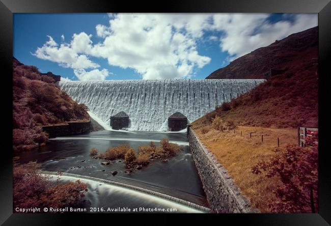 Caban Coch dam in full flow Framed Print by Russell Burton