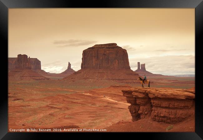 Lone Horseman Overlooks Monument Valley Framed Print by Toby Bennett