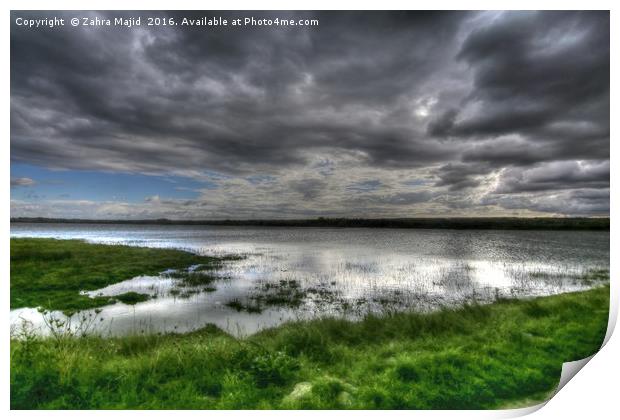 Dark Clouds reflecting in Marshes Print by Zahra Majid