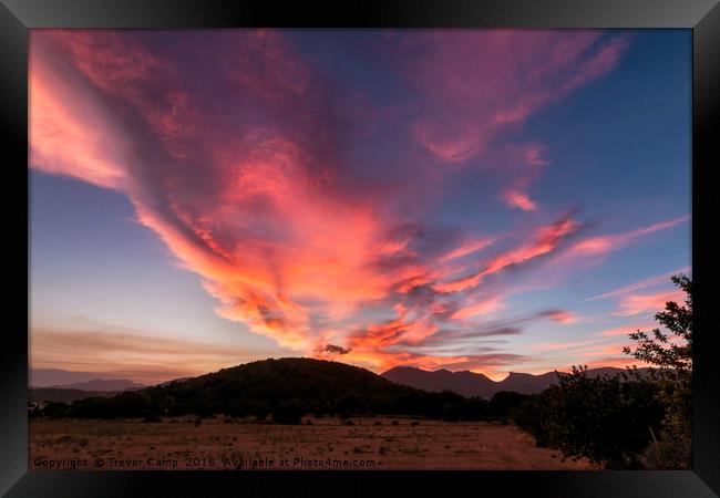 Pollenca's Fiery Sky Framed Print by Trevor Camp