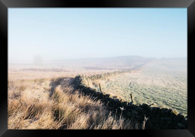 Curved wall in the frost and fog on Beeley Moor at Framed Print by Liam Grant