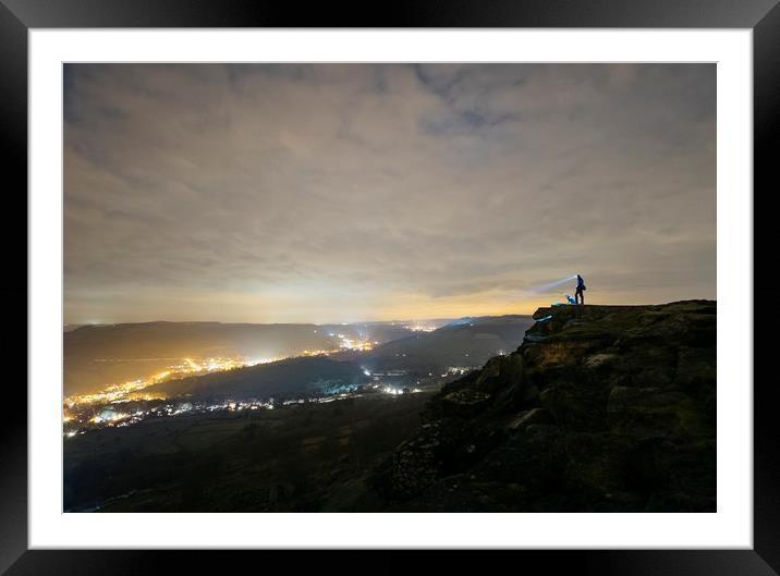 Male and his dog, standing on Curbar Edge at night Framed Mounted Print by Liam Grant